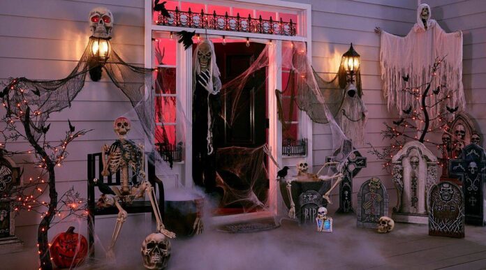 Porch that is ready to welcome guests on Halloween with a whole lot of spookiness!
