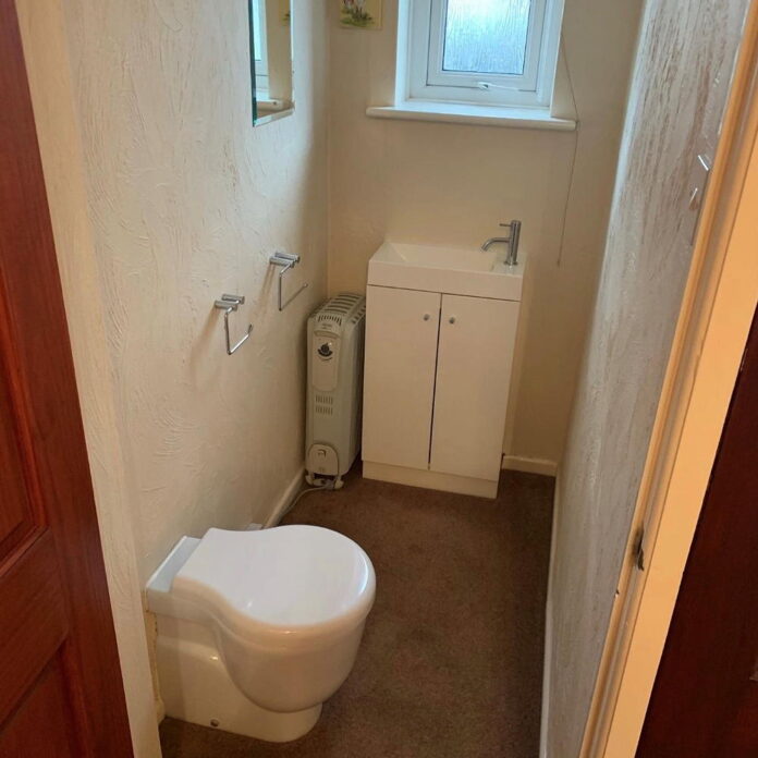 This brown carpeted bathroom has been transformed into a swoon-worthy cloakroom