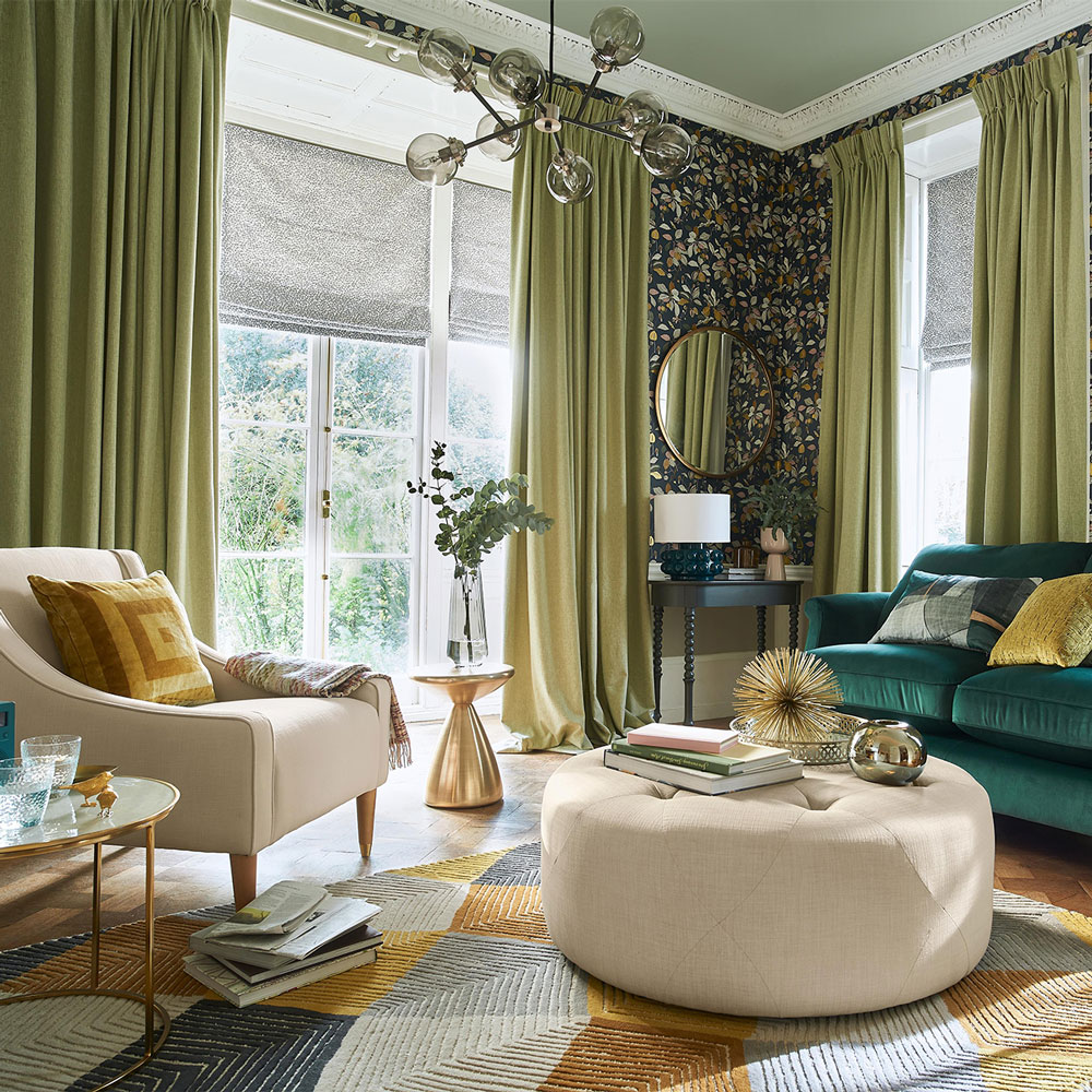 Living room with green curtains and green sofa