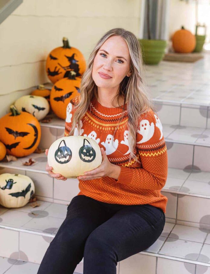 Emma holding a pumpkin 