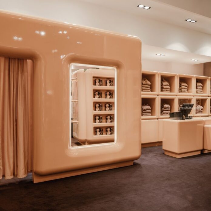 The beige interior of SKIMS pop up store in Paris