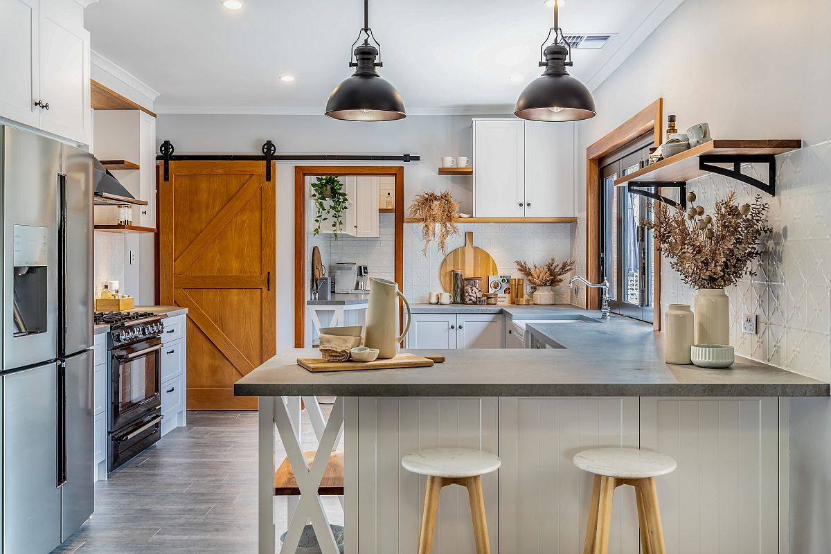 Beautiful farmhouse kitchen with engineered quartz countertops and lovely lighting