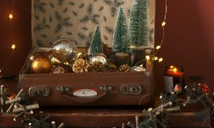 Vintage suitcases filled with Christmas decorations