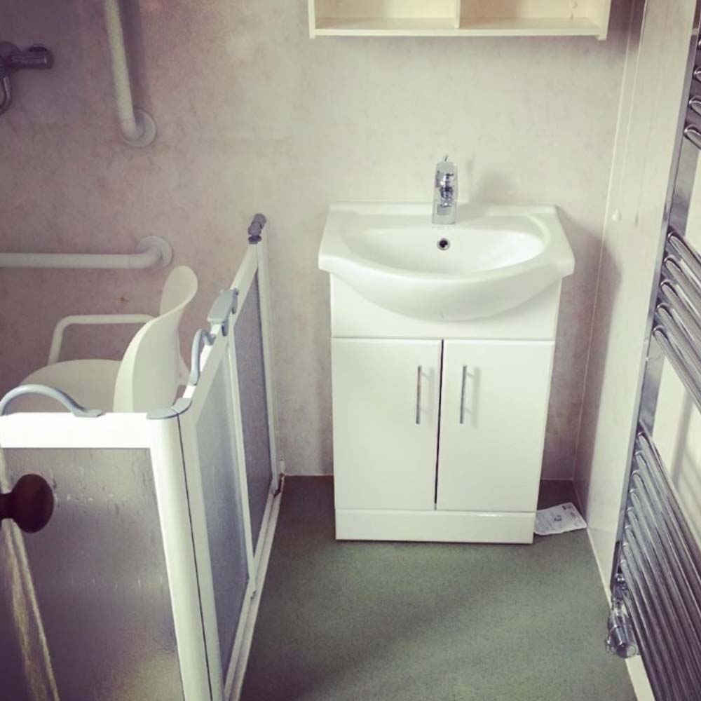 bathroom before makeover with sink and shower