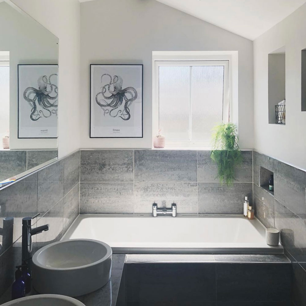 Grey tiled bath in small bathroom before makeover