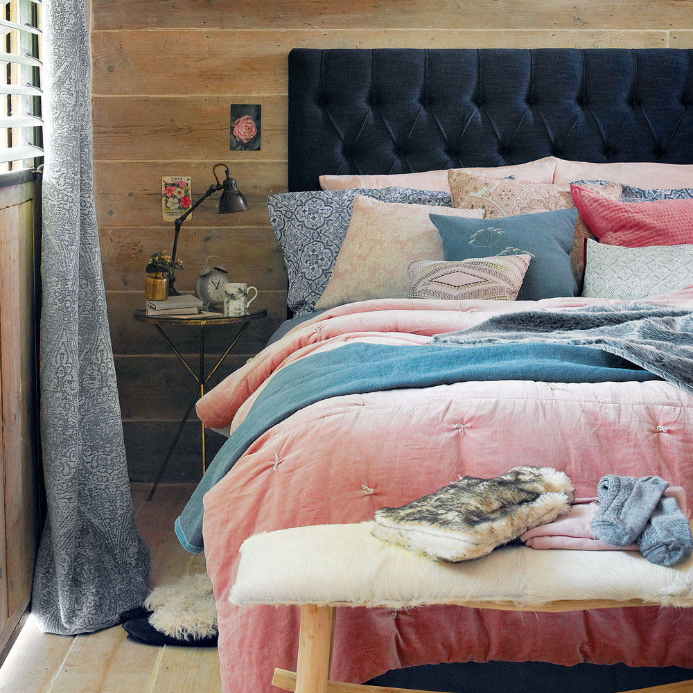 Double bed with blue headboard