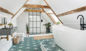 bathroom in attic with tiled flooring and grey cement sink