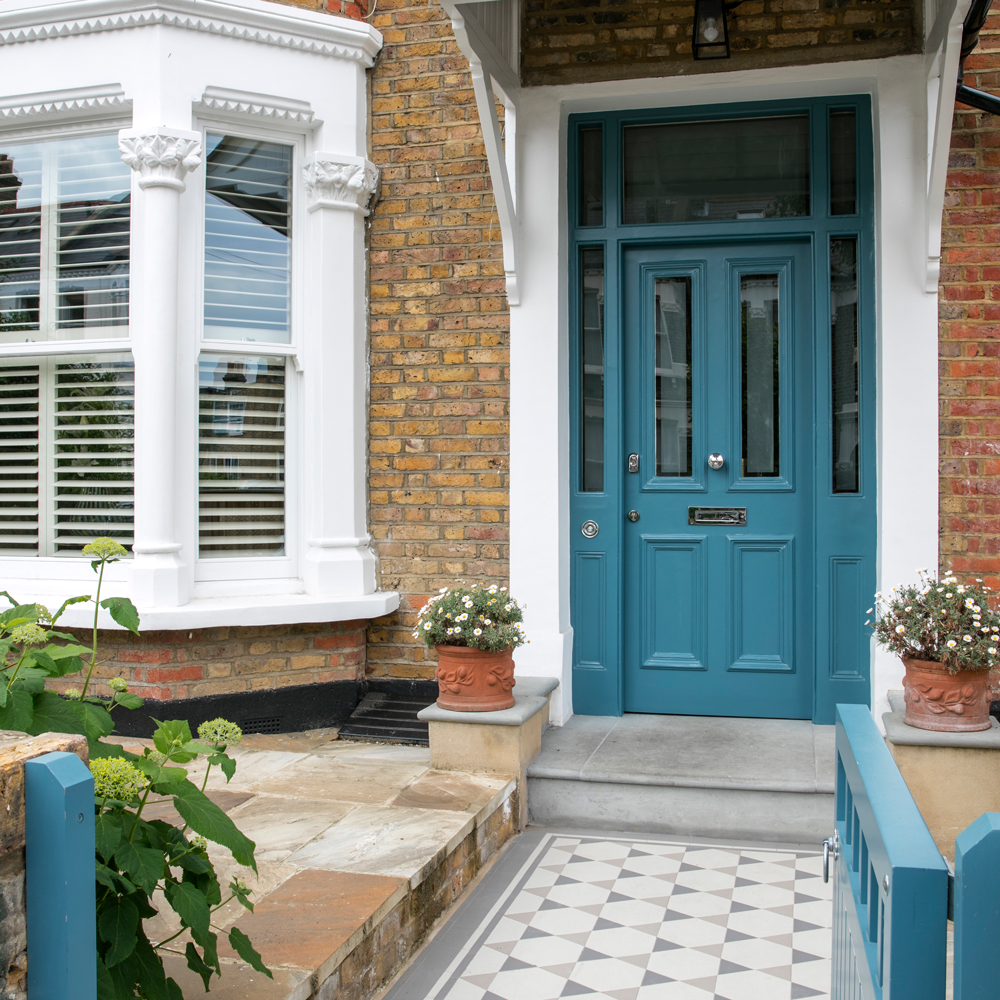 House exterior with teal blue font door