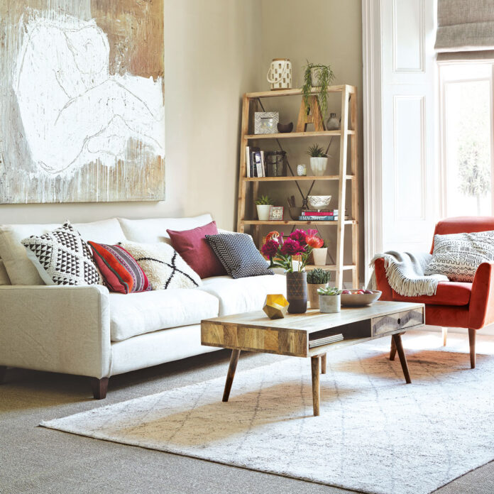 Neutral lving room with wooden coffee table and wooden ladder shelf