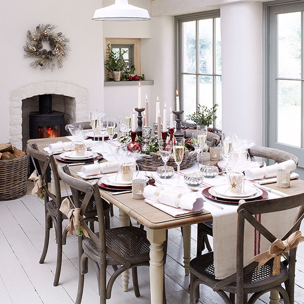 Simple Christmas table decor ideas with linen stripe table runner and wooden chairs