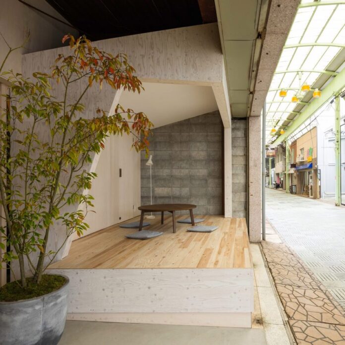 Recessed facade with plywood meeting room in Yoridoko employment centre by Td-Atelier