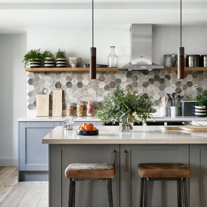 Kitchen with grey island and hexagonal splashback