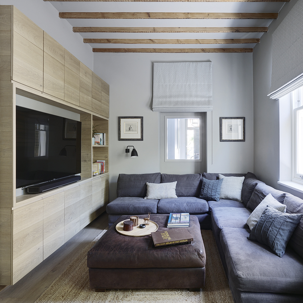 TV room with large grey corner sofa