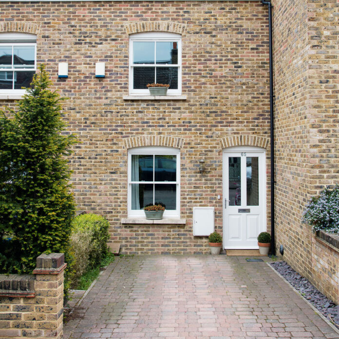 victorian house with brick drive