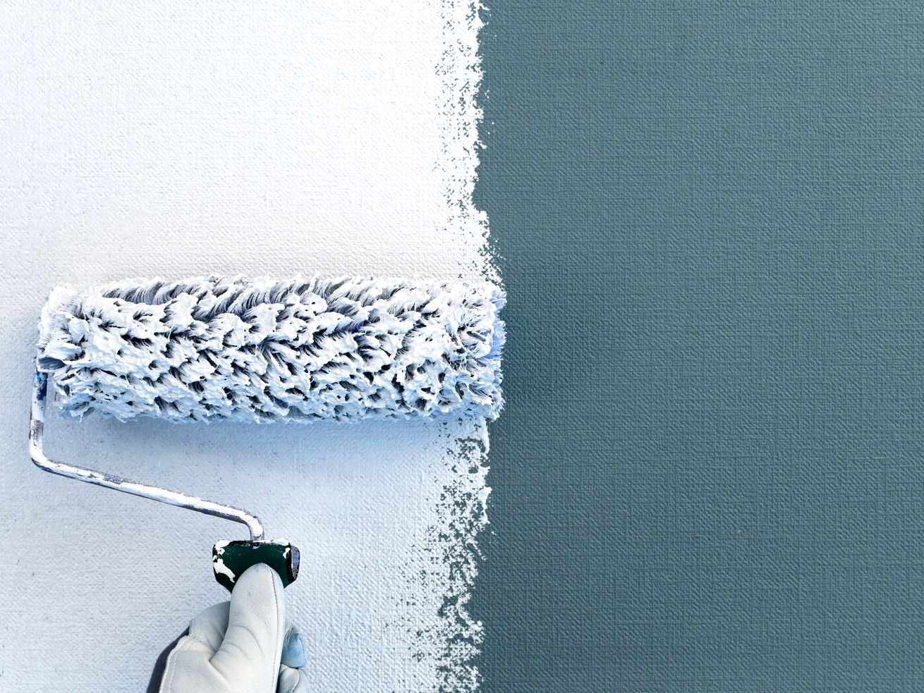 Paint Over Wallpaper with a roller brush.