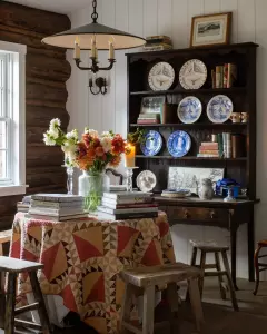 a cozy log cabin interior - quilt top table and hutch.