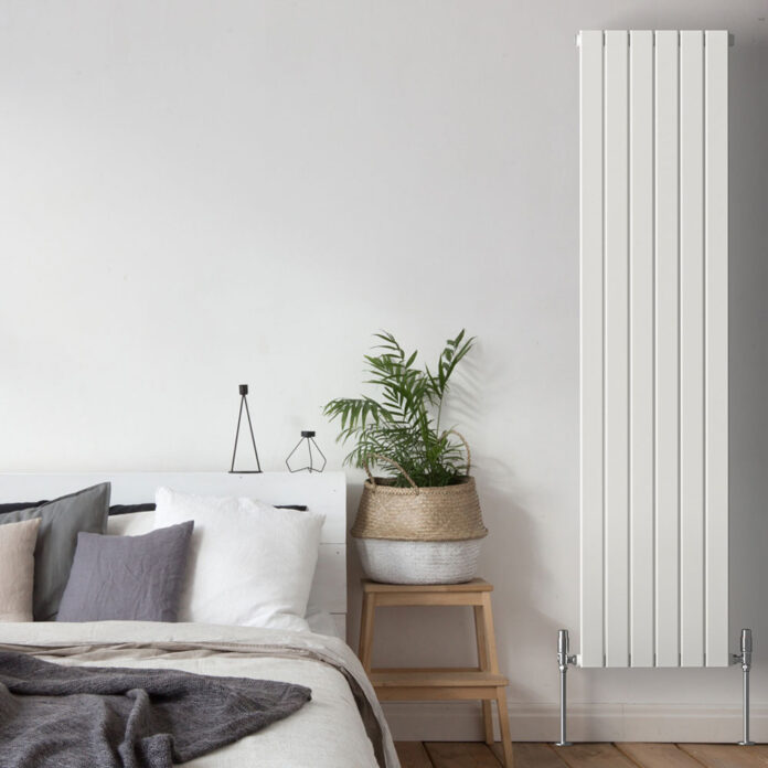 white bedroom with vertical radiator