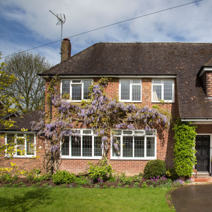 Country house with wisteria and mature lawn