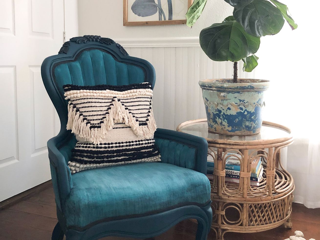 A vintage arm chair that has been painted blue.