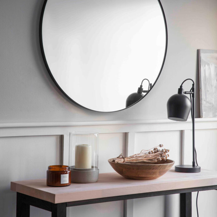 circular mirror in hallway