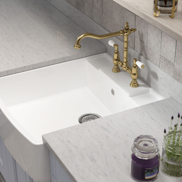 lovely sink in grey country kitchen with gold tap