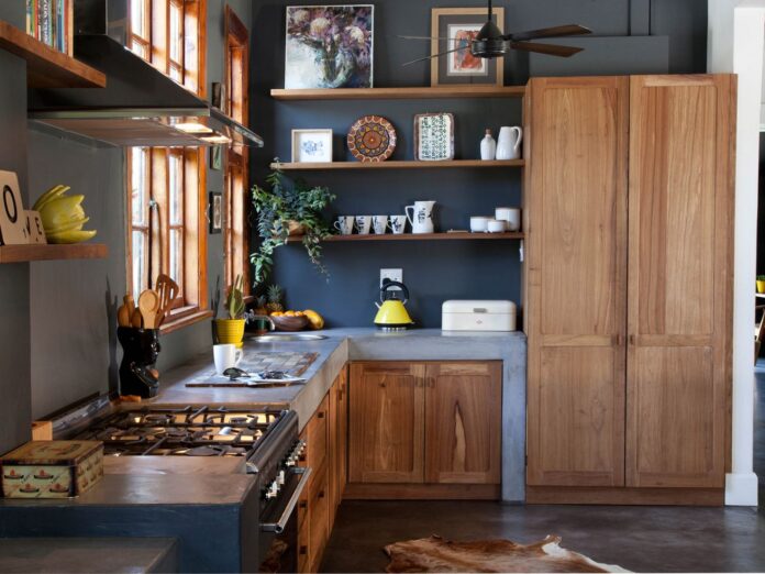 A kitchen with a thick concrete waterfall countertop