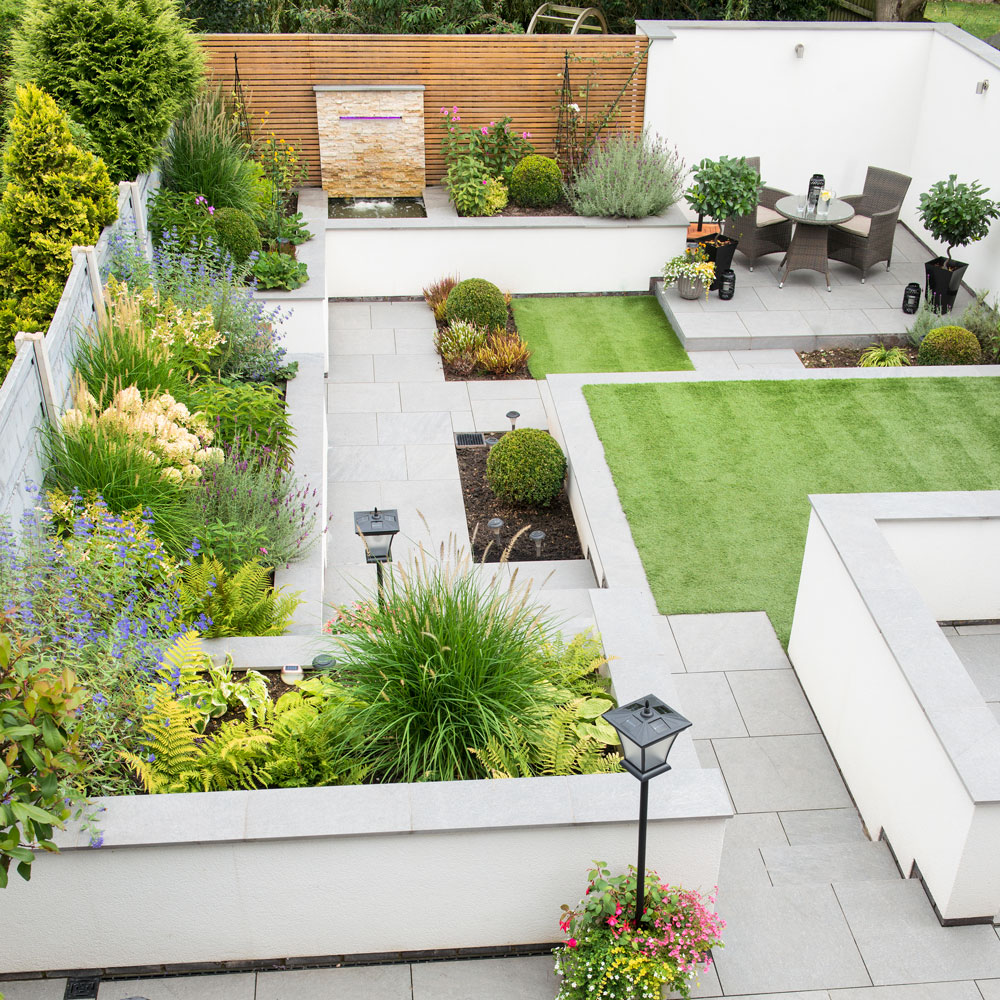 garden with patio areas and paving