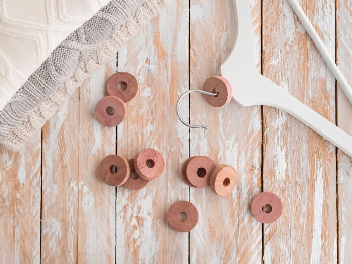 Cedar discs added to hangers to deter moths