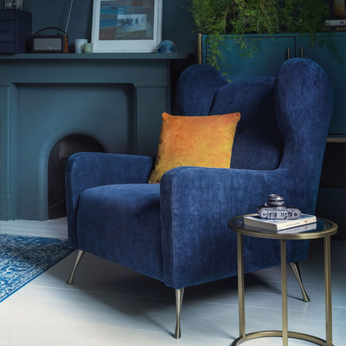 Navy blue living room with blue velvet armchair