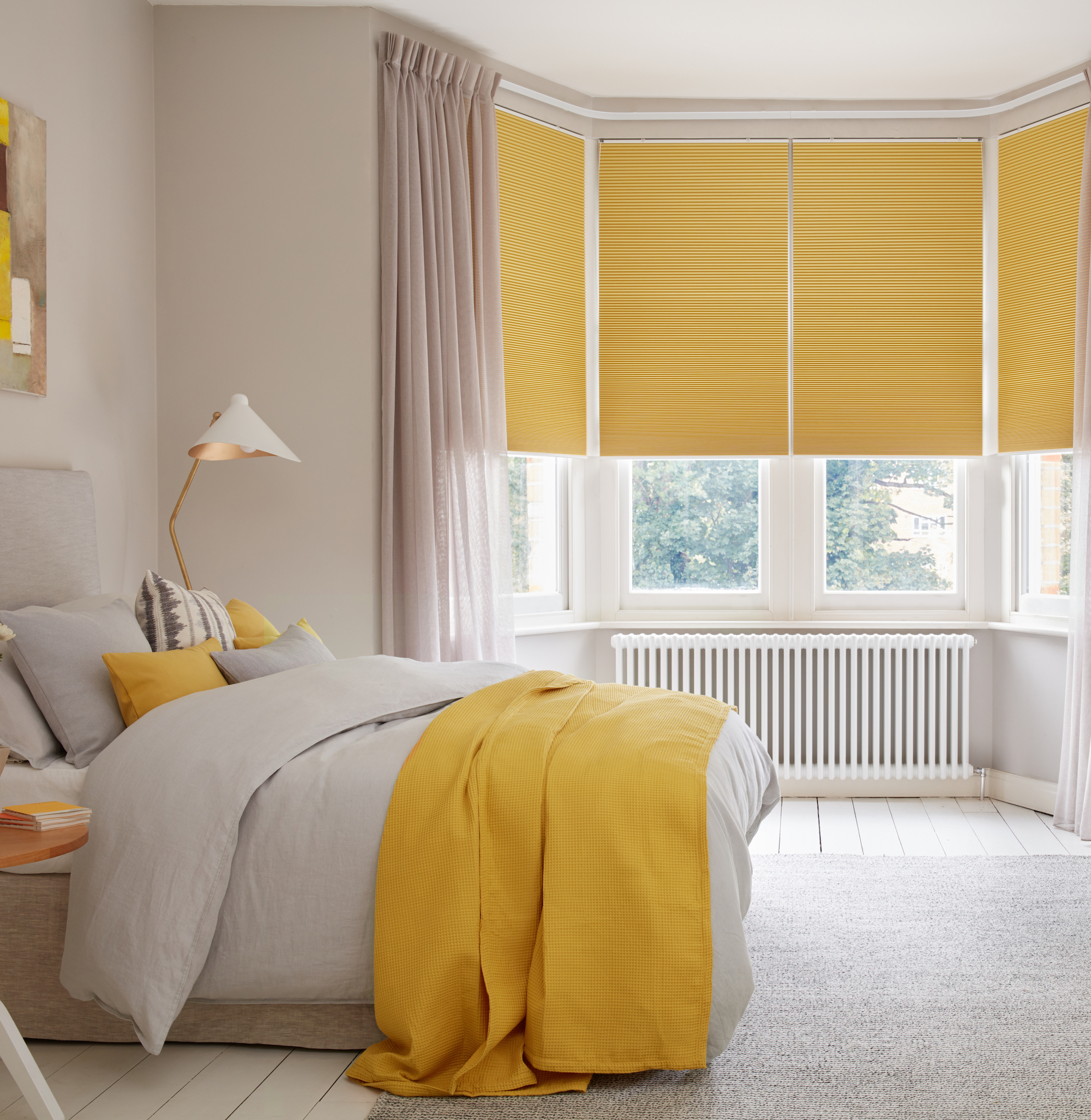 Yellow blinds in pink room 