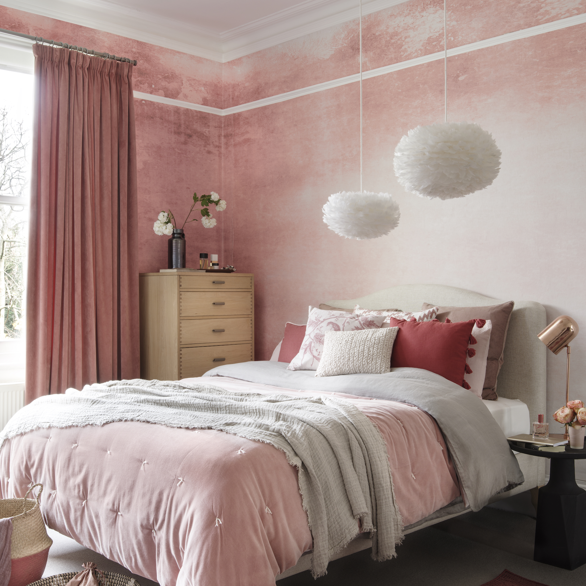 Pink bedroom with white lamps