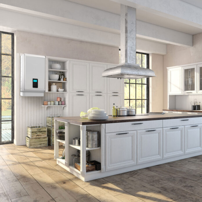 White kitchen with large island and dark wood floor