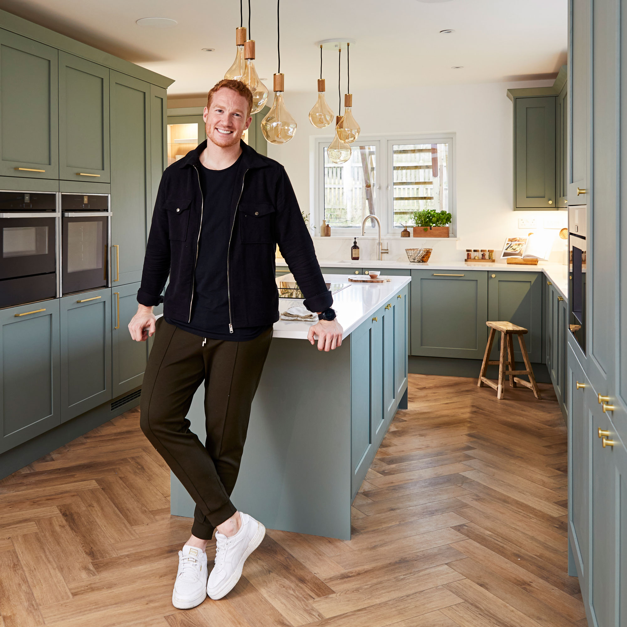 greg rutherford in green kitchen