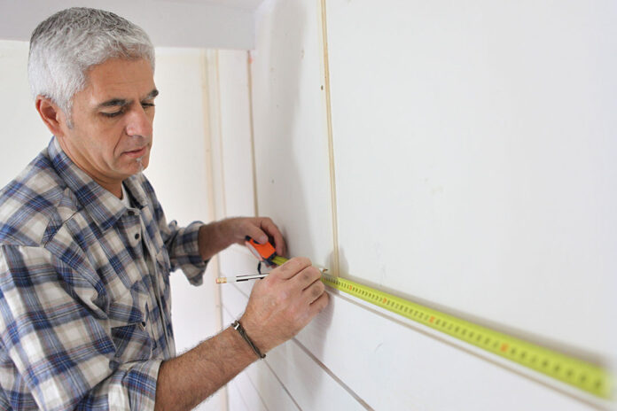 Man Installing IKEA Kitchen