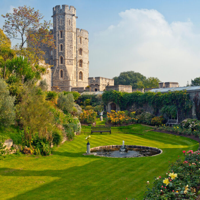 windsor castle and gardens with pond and flowers