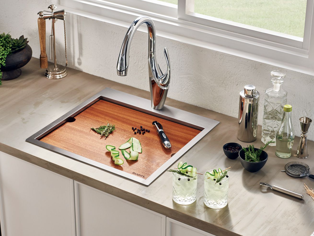 Sink with a built in cutting board