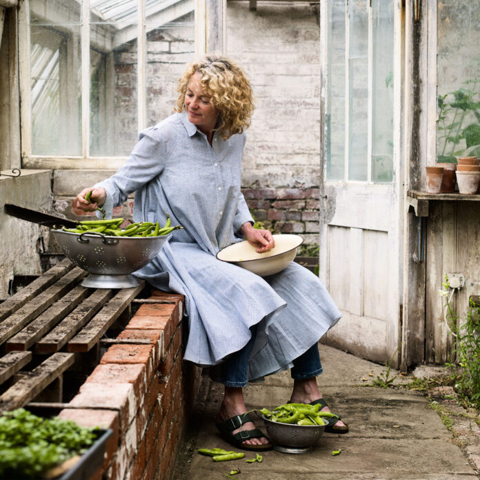 Kate Humble in greenhouse with green beans