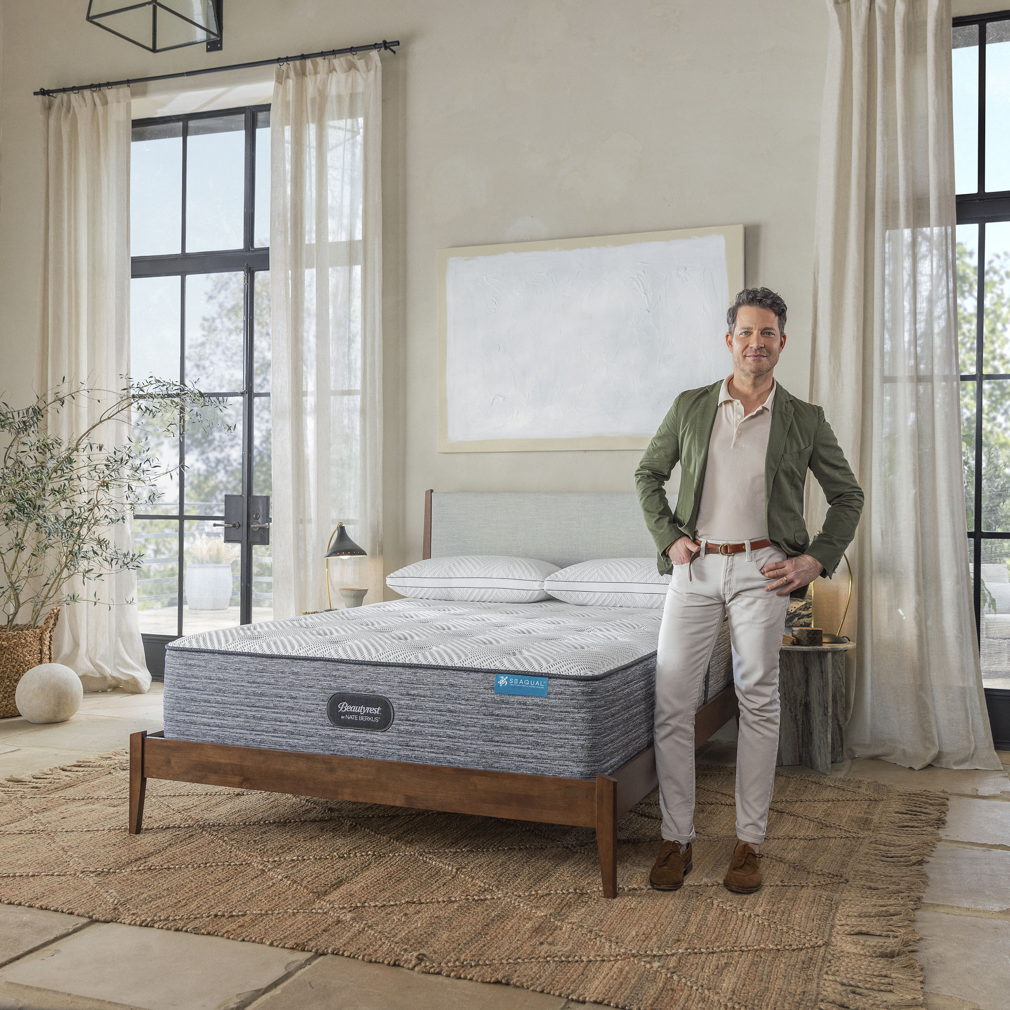 nate berkus with beautyrest bedding collection with mattress and pillows in neutral bedroom
