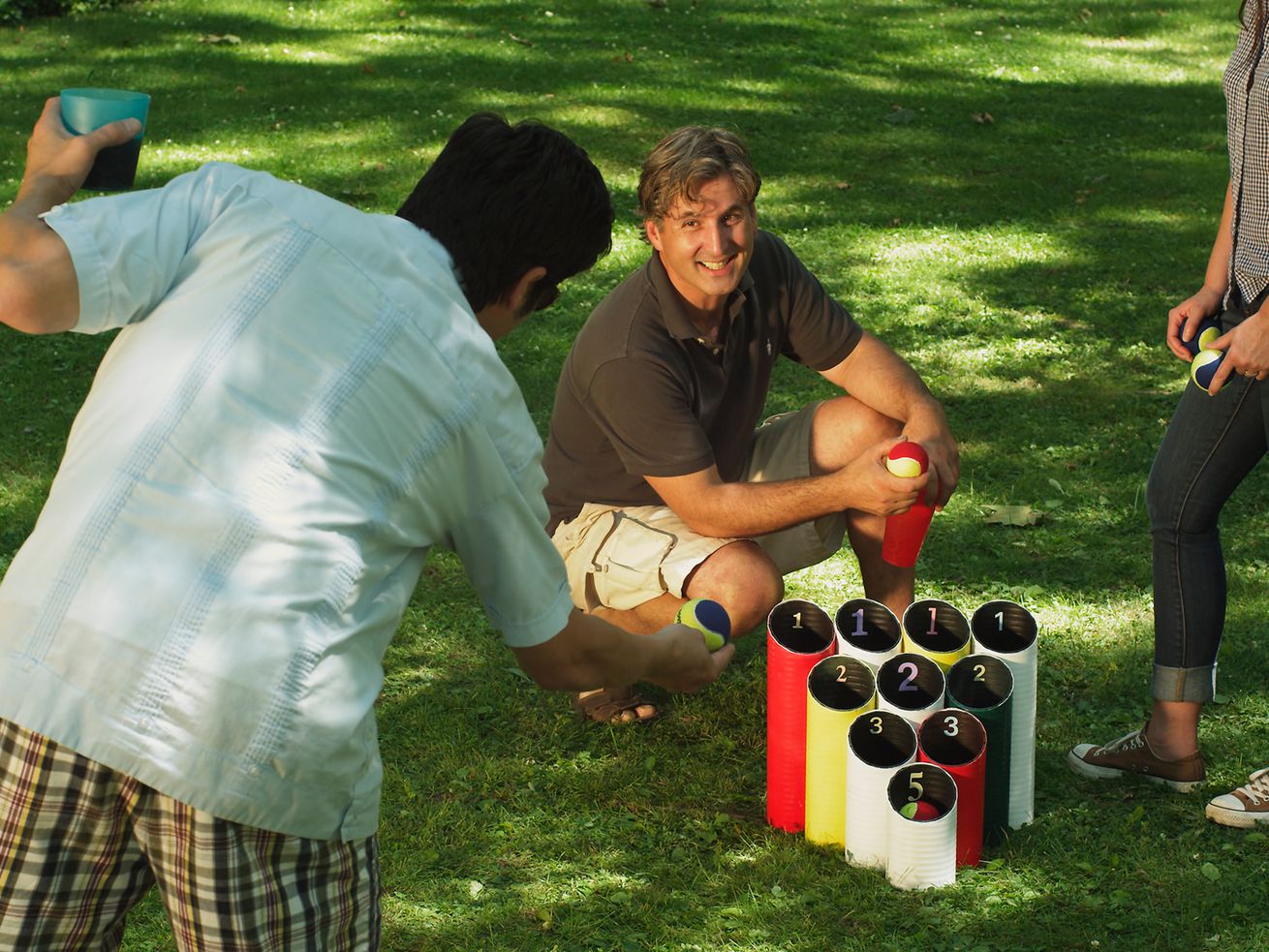 Group of friends playing a pipe ball lawn game