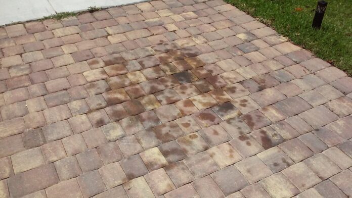 Need assistance removing oil stain from pavers on my driveway : r/DIY