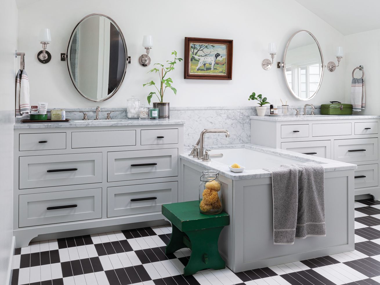 Black and white bathroom with bright green stool in the center