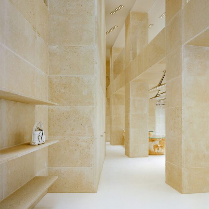 Interior image of Acne Studios limestone-clad Rue Saint Honoré store