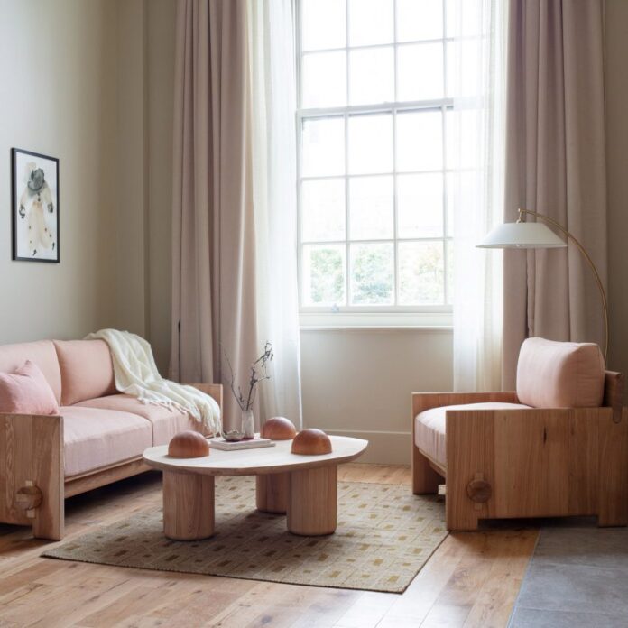 Living room of suite 109 in Town Hall Hotel with pink-upholstered sofa and armchair by Jan Hendzel at LDF