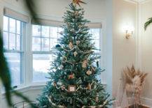Christmas tree in front of window