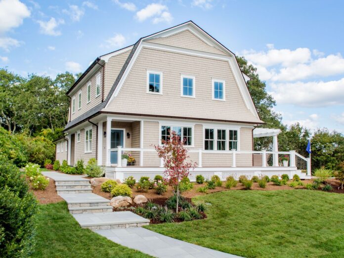 A large house with a wrap around porch 