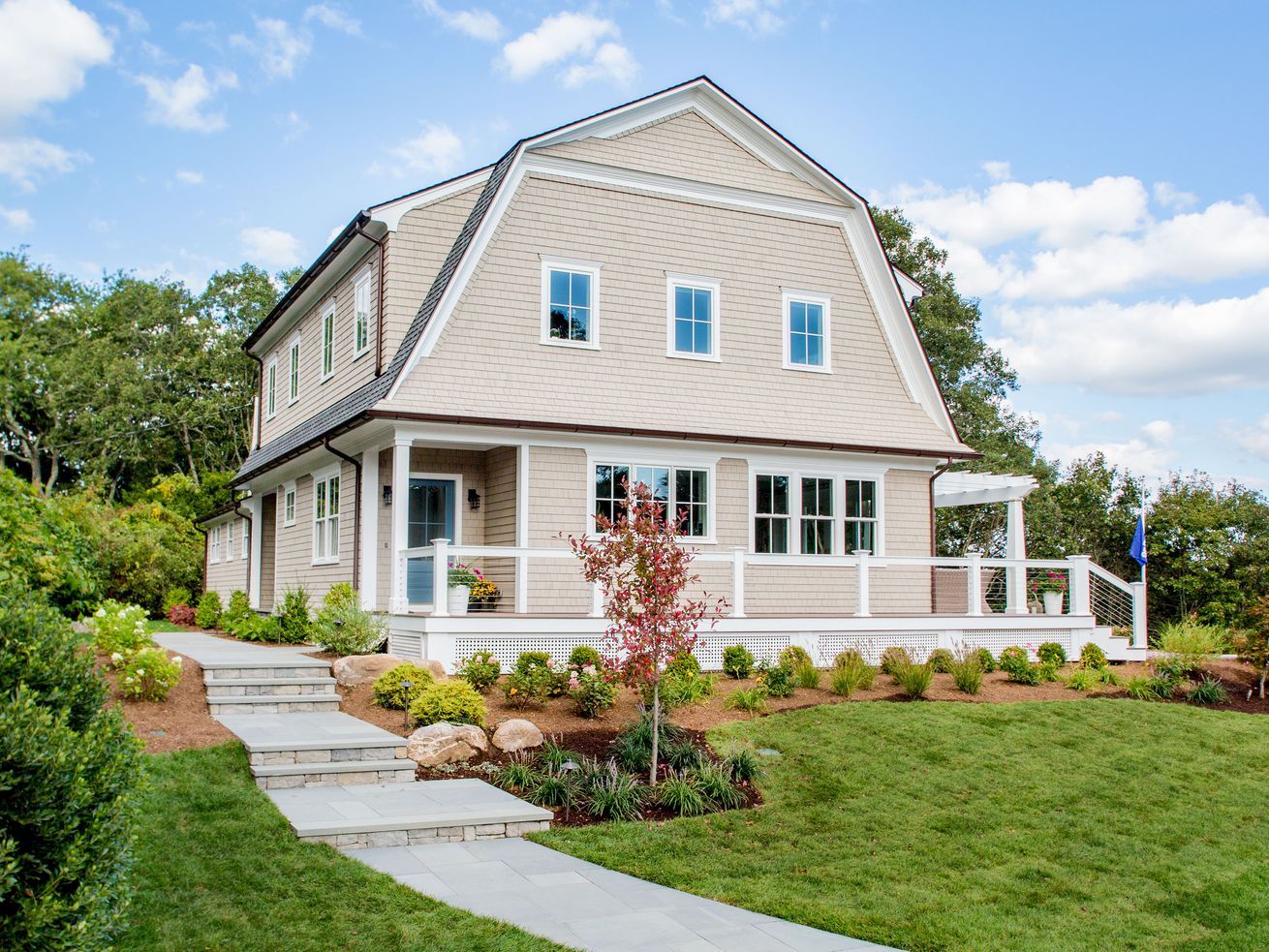 A large house with a wrap around porch 