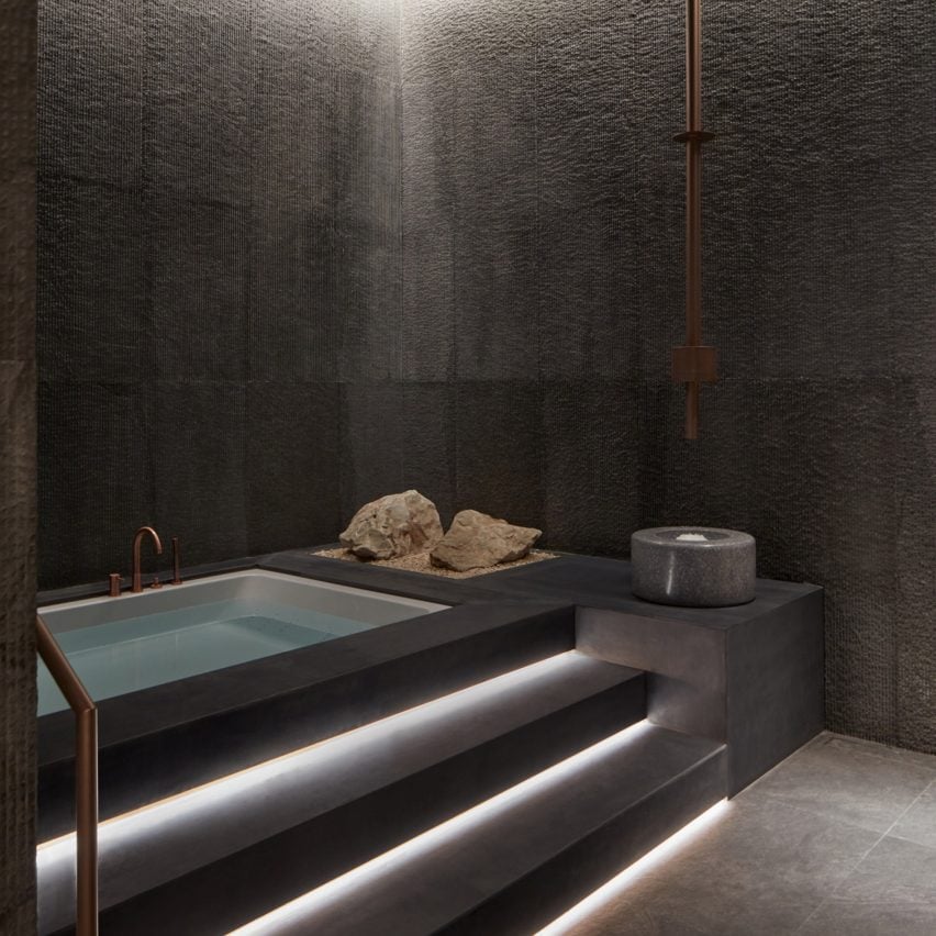 Spa bath with low light on the stairs to the pool