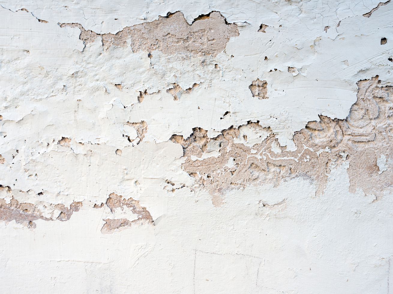 Peeling paint on concrete wall