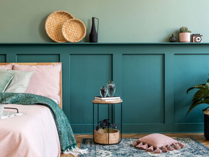 Teal wood paneling in bedroom