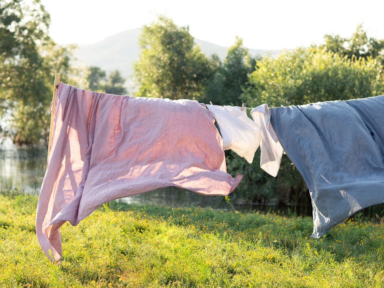 Freshly cleaned sheets hanging outside to dry.